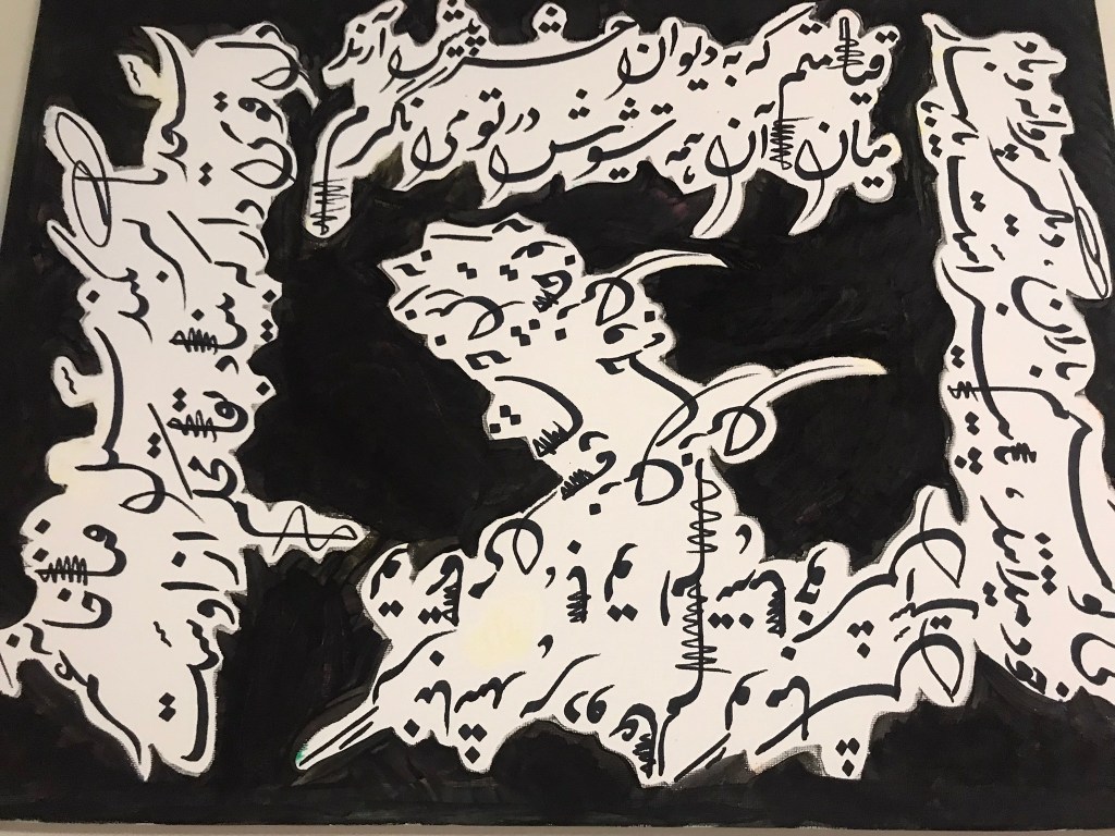 Abstract artwork featuring white stylized script-like forms against a black background, creating a chaotic yet intriguing composition.